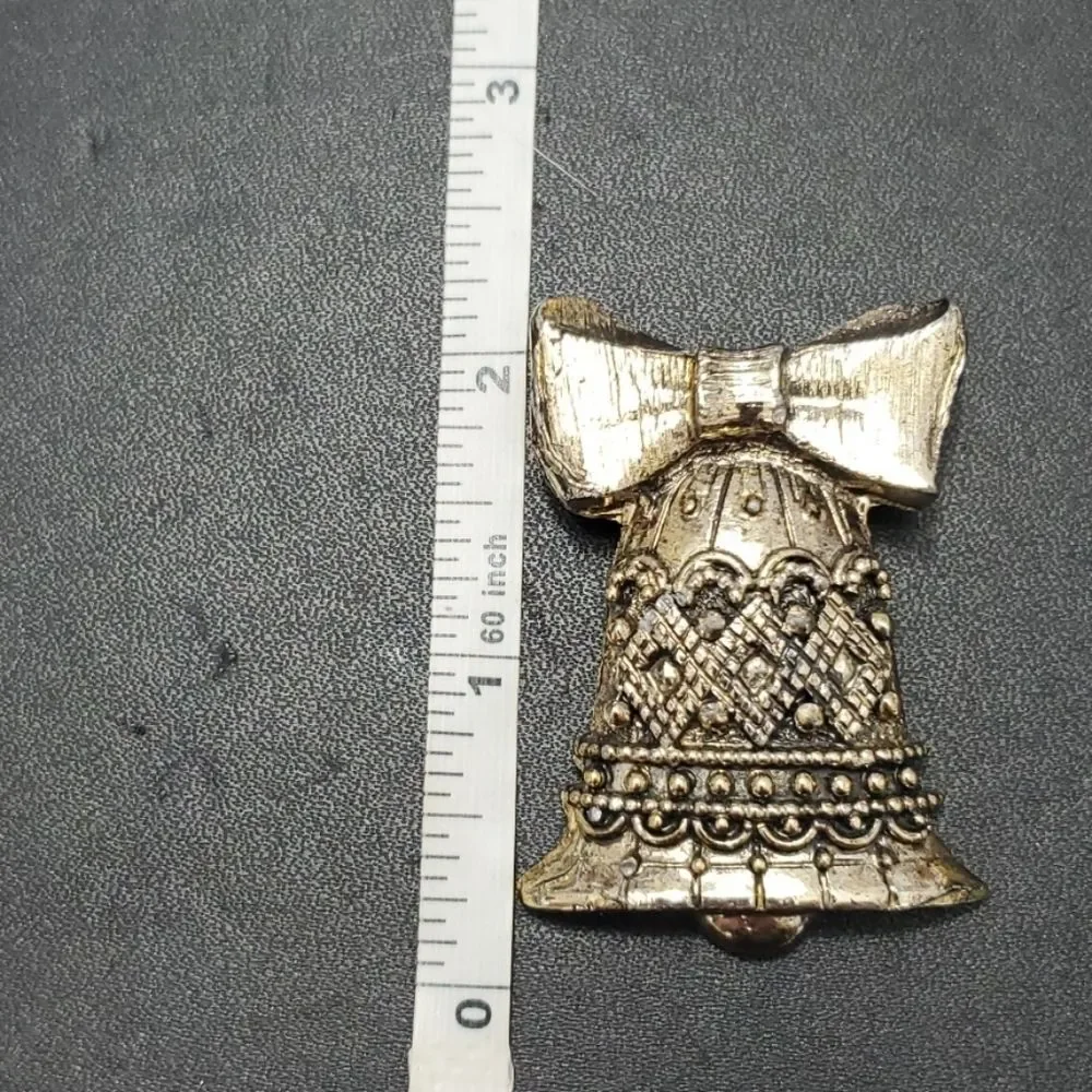 Vintage gold tone bell brooch